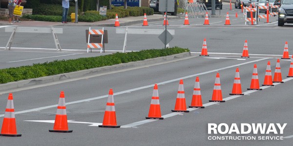 How Can We Fix It words on a road construction barrier Stock